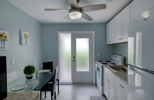 Singer Island Apartment | Modern condo near towering palms with beach decor, grill, & yard - walk to beach