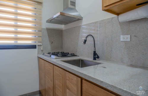 La Paz Condo | Modern Condo, Pools, Private BBQ, Malecon 4 Blocks