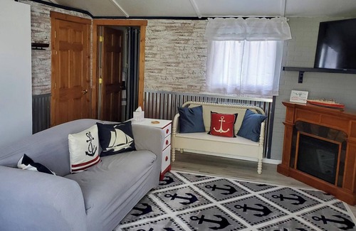 Evart Cottage | Modern cottage with dock and frontage on private lake.