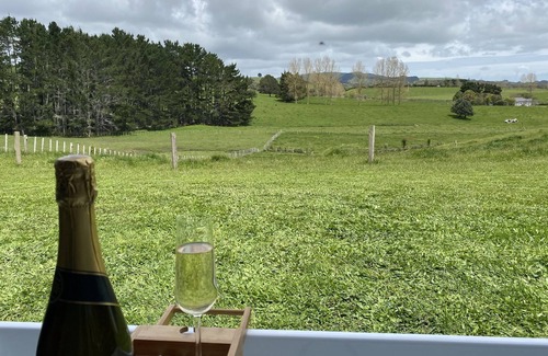Raglan House | Modern, cozy, Beachy Bach with beautiful rural views in Raglan
