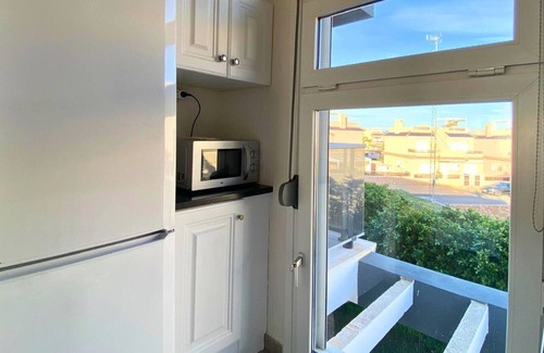 Orihuela Costa Apartment | Modern flat with swimming pool, terrace and equipped solarium