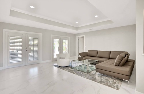 Palm River Estates House | Modern home with a pool, patio, hot tub, grill, washer/dryer, and central AC