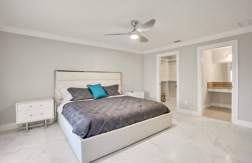 Palm River Estates House | Modern home with a pool, patio, hot tub, grill, washer/dryer, and central AC