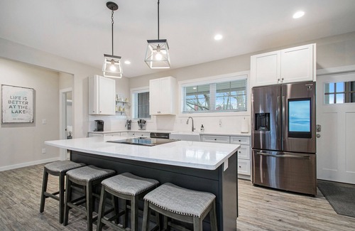 Sawyer House | Modern home with large sun-room, firepit, grill, washer/dryer, & central AC