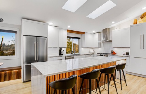Milton House | Modern home with outdoor fireplace, rock-wall, & walk-in shower