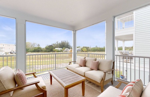 Cortez House | Modern home with screened-in balcony, pool, bikes, & EV charger - great location