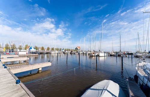 Volendam Boat Rental | Modern houseboat in Volendam with shared pool