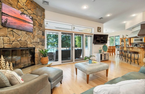 Laconia House | Modern Lake Opechee Home features Sandy Perched Beach and Dock