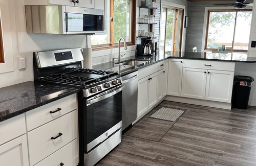 Shawano Cottage | Modern lakefront cottage. 30 minutes to Lambeau Field! Bonfires, fishing, & more