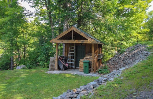 Dysart et al Cottage | Modern log cabin with wrap around deck on Little Kennisis