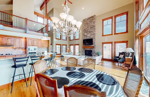 Grand Elk Ranch House | Modern mountain view home with balconies, Ping-Pong table, grill, & fireplace