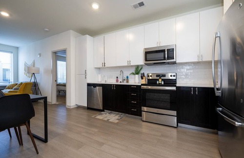 Downtown Louisville Apartment | Modern Nulu 2BR CozySuites 01
