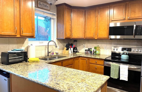 Lamar Heights Area House | Modern & Spacious - 5 King Beds With Private Backyard Oasis & Sunroom