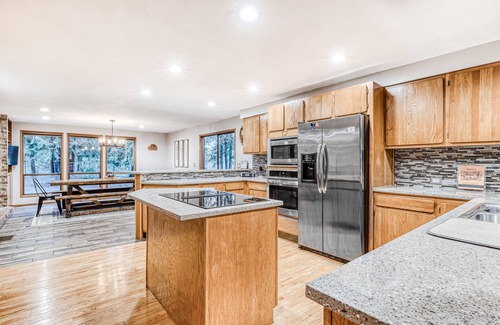 Rhododendron House | Modern, spacious getaway with private hot tub, wood fireplace, WiFi, & game room