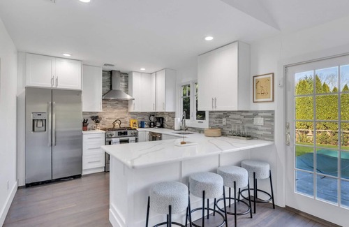 East Hampton House | Modern-style home with private pool, open-floor living plan, back porch,.