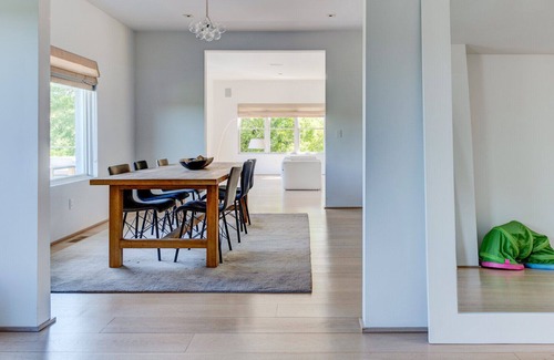Eastport House | Modern-style home with a private pool, vast back lawn, several sitting...