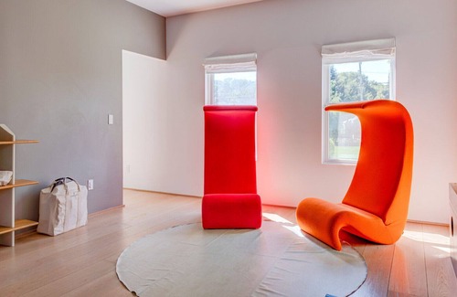 Eastport House | Modern-style home with a private pool, vast back lawn, several sitting...