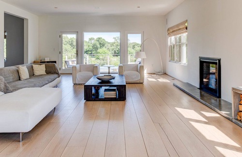 Eastport House | Modern-style home with a private pool, vast back lawn, several sitting...