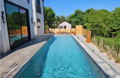 Aquebogue House | Modern Zen beach oasis with pool in Jamesport Bay.