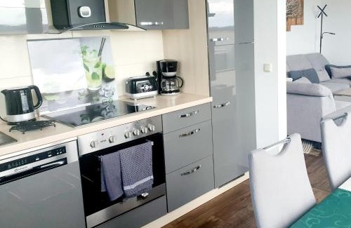Ziemitz Apartment | Moderne Ferienwohnung mit Balkon direkt an der Peene