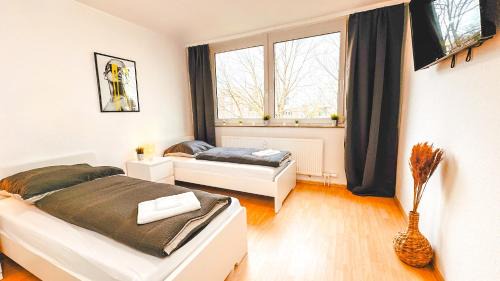 Hustadt Apartment | Monteurwohnung mit Balkon und Wohnzimmer