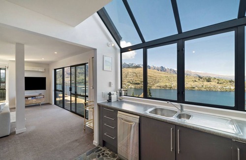 Queenstown House | Mountain and lake views and wood burner inside.