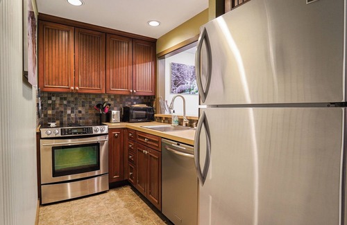 Glacier Condo | Mountain Modern Snowater condo! Fireplace, Pool, Spa, Sauna, indoor sports courts!
