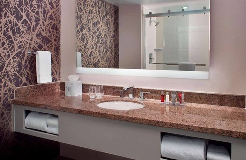 Downtown Hotel | Near Red Hat Amphitheater + Dining. Pool. Gym.