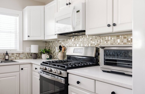 Federal Heights House | Nest out west in this professionally designed 2 BD/3 BA townhome. Sleeps 6.