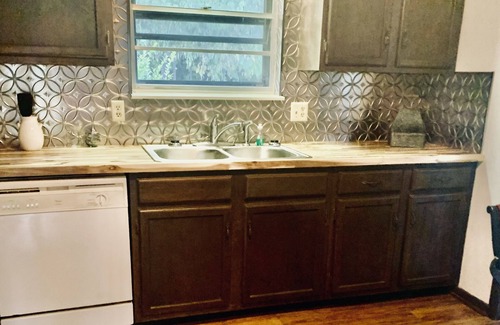 Kodak House | Nestled in the woods above the French Broad River, quite subdivision.