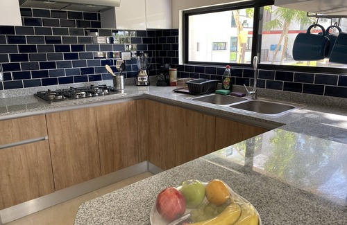 Cancun Apartment | New Apartment, first floor , security 24/7, garden/place for kids, outdoor pool.