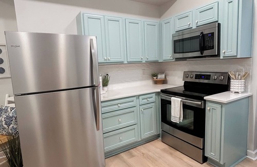 McCutcheon Field Condo | ☀️NEW☀️ Beachfront 2BR 2BA with Heated Pool, Playground, Gym, and Arcade!