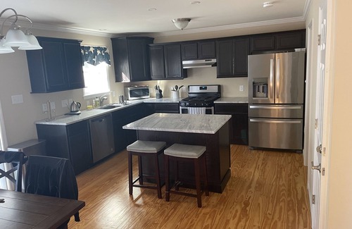 East Dennis House | New construction cape house close to shops and 3 miles from the beach .