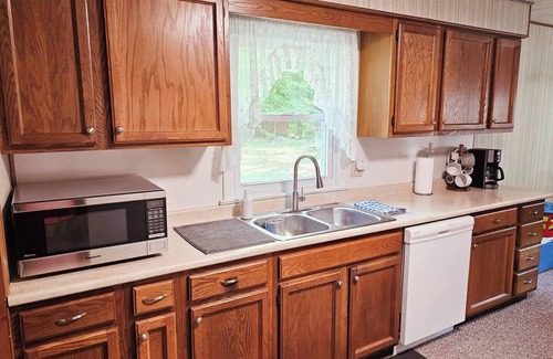 Kalkaska Cabin | New! Forrest's Cabin and Vivian's Cabin - Two Cabins with Private Lakefront and Dock!
