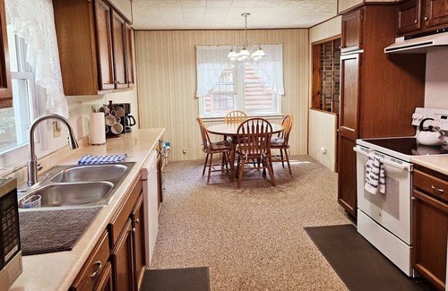 Kalkaska Cabin | New! Forrest's Cabin and Vivian's Cabin - Two Cabins with Private Lakefront and Dock!