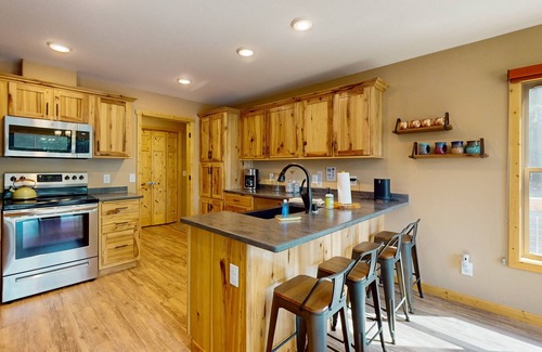 Three Lakes House | NEW lakefront escape with dock, game room, kayaks, 2 master suites & large deck