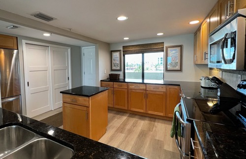 Madeira Beach Condo | NEW! Luxuriously Updated & Renovated Beachfront Retreat- Walkable to Fun!