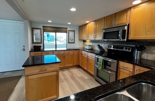 Madeira Beach Condo | NEW! Luxuriously Updated & Renovated Beachfront Retreat- Walkable to Fun!
