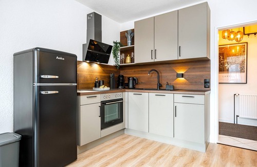 Emden Apartment | NEW! Modern apartment at Larrelter Tief - balcony, private parking & FIRE TV!