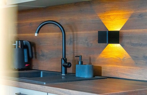 Emden Apartment | NEW! Modern apartment at Larrelter Tief - balcony, private parking & FIRE TV!