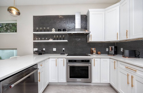 Ridge Wood Heights House | New modern home with salt water heated pool located minutes from SiestaKey Beach