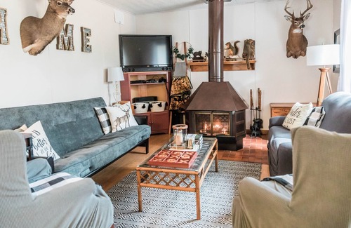 Neillsville Cottage | NEW! Secluded Cozy Cottage w/Deck, BBQ & Fire Pit!