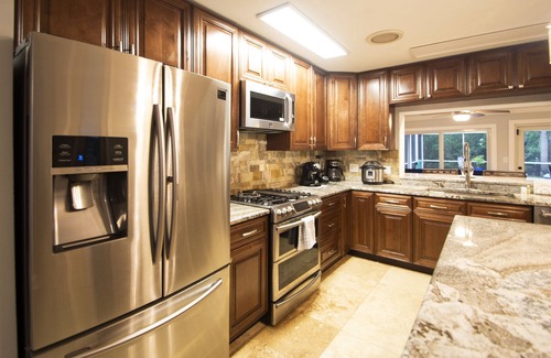 Fort Myers House | NEW! Waterfront Heated Pool, Kayaks, Fishing Pier, Fire Pit w/office