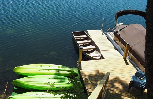 Mancelona Ski Chalet | NEW! Woods and Waters - Large, Family-Friendly, and Lakefront with Watercraft!