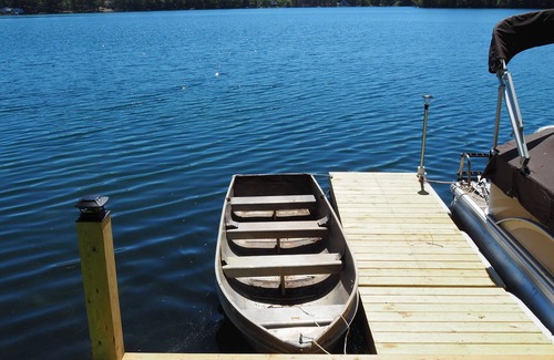 Mancelona Ski Chalet | NEW! Woods and Waters - Large, Family-Friendly, and Lakefront with Watercraft!