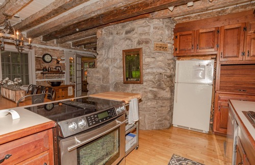 Baileys Harbor House | Newly Remodeled Waterfront Log Cabin with Boat House and Pier