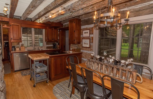 Baileys Harbor House | Newly Remodeled Waterfront Log Cabin with Boat House and Pier