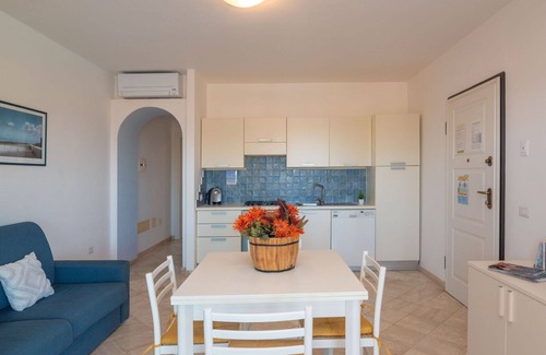 Santa Teresa di Gallura Apartment | Nice apartment for 4 people with A/C, WIFI, pool, terrace, pets allowed and parking