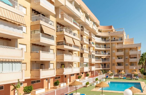 Roquetas de Mar Apartment | Nice apartment for 4 guests with A/C, WIFI, pool, TV, terrace and pets allowed