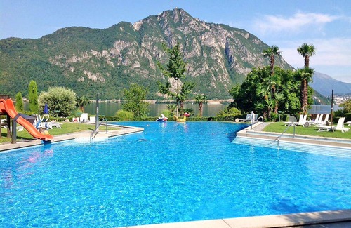 Bissone Apartment | Nice apartment for 4 guests with pool, WIFI, A/C, TV, balcony, panoramic view and parking